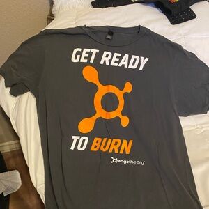 Three women Orange Theory T-shirts. In good condition.